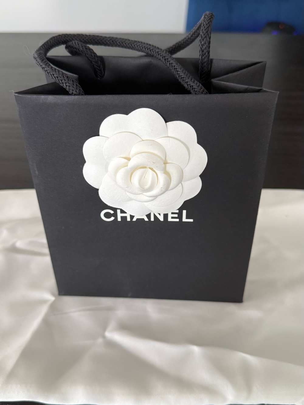 CHANEL Black Gift Bag with White Camellia Accent